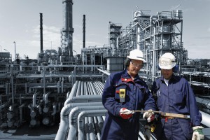 refinery workers inside oil and gas installation